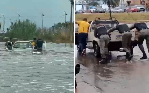 Policiais entram em enchente para resgatar casal ilhado dentro de carro em Goiás